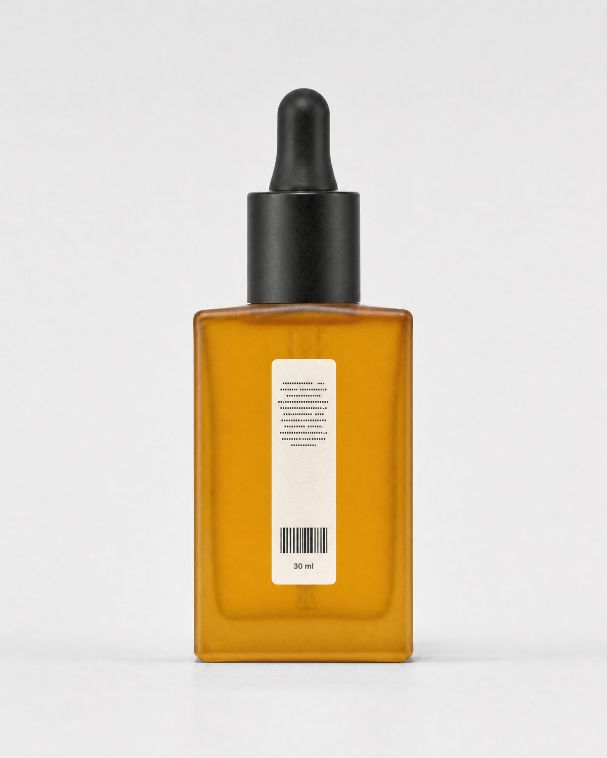 Amber glass serum bottle with dropper, back view