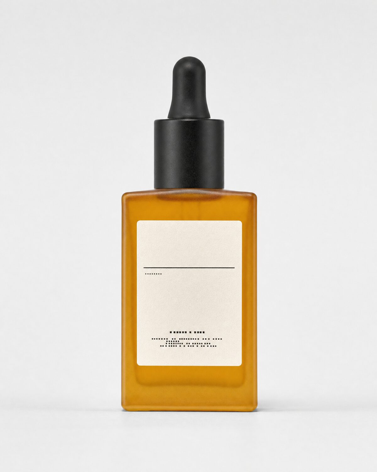 Amber glass serum bottle with dropper, front view