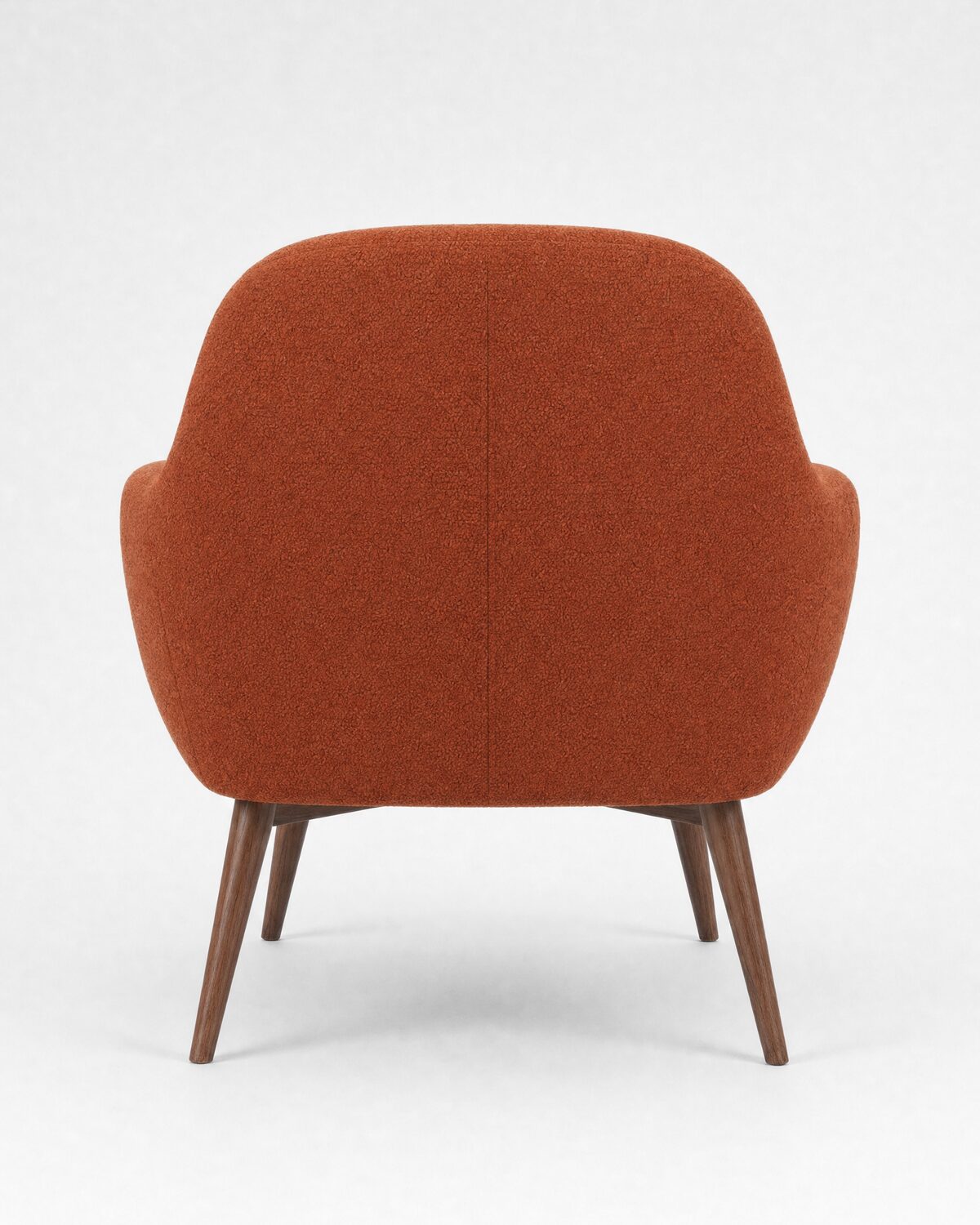 Lounge armchair in rust bouclé and walnut, back view
