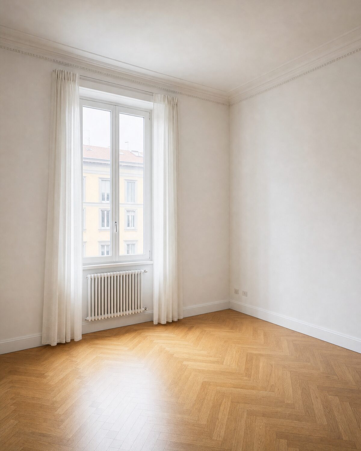 Empty living room in Milan, three-quarter view