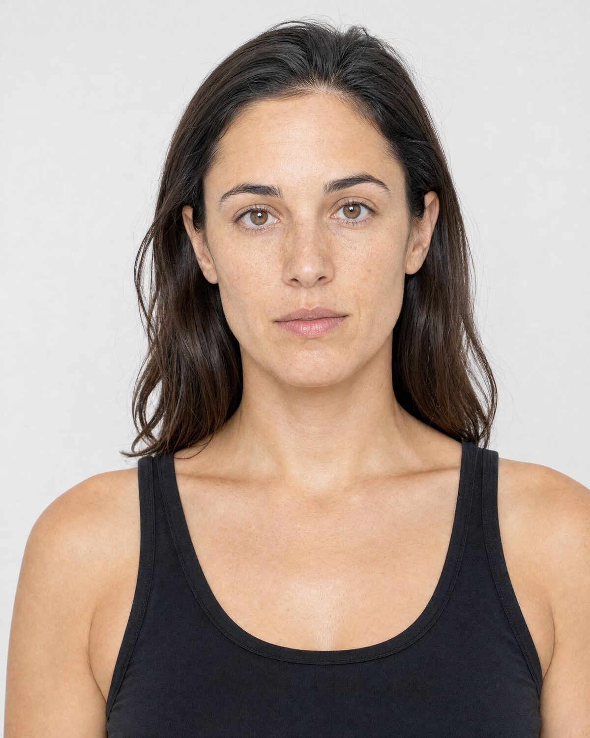 Casting reference in fitted, neutral clothing, close-up