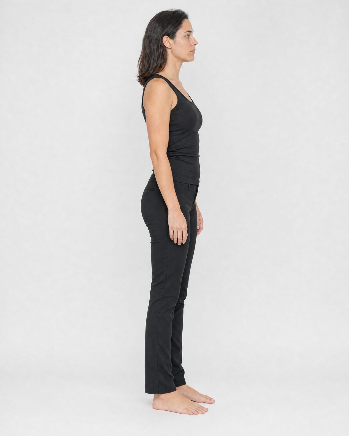 Casting reference in fitted, neutral clothing, side view
