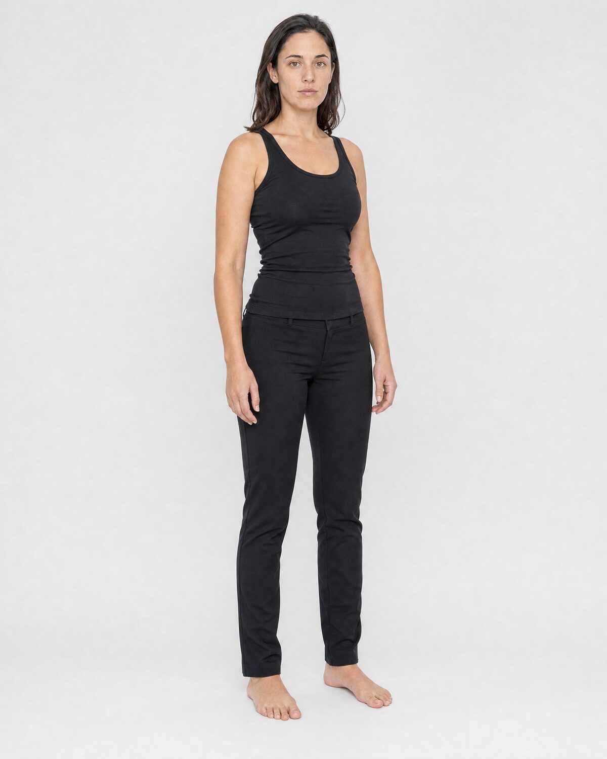 Casting reference in fitted, neutral clothing, three-quarter view